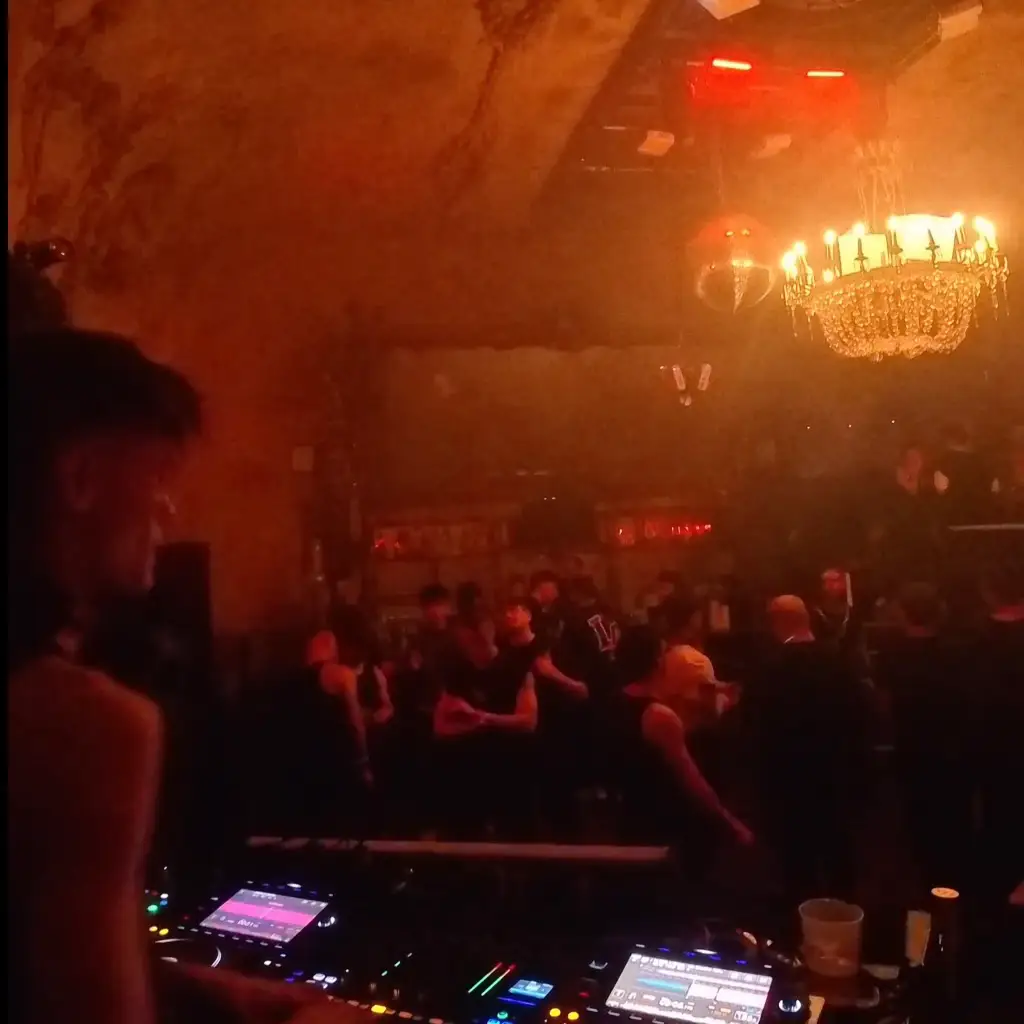 Crowd hands up in blue light